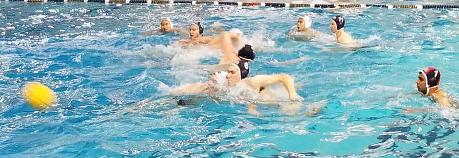 water polo ball on water with players battling in a scrimmage